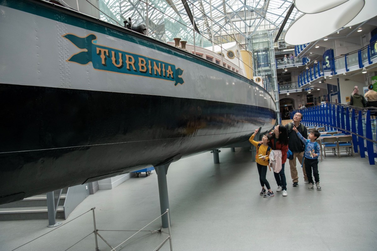 Charles’ Parson seminal ship Turbinia, in situ in Discovery Museum with visitors. Photo courtesy of Tyne & Wear Archives & Museums. 